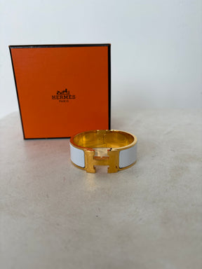 Hermès Gold Tone and White Enamel Clic Clac H Bracelet`