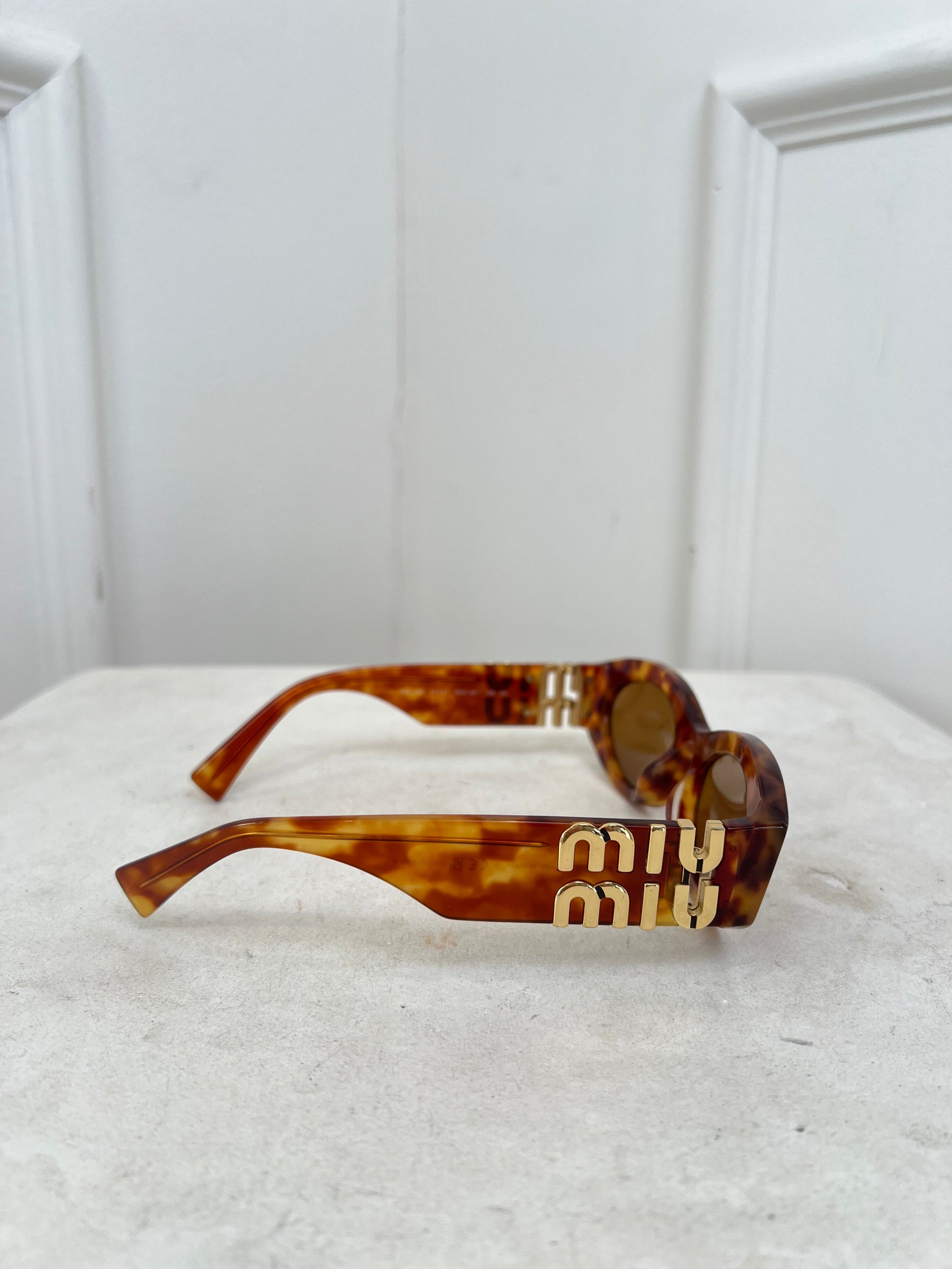 Miu Miu Tortoiseshell Oval Logo Arm Sunglasses