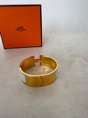 Hermès Gold Tone and White Enamel Clic Clac H Bracelet`