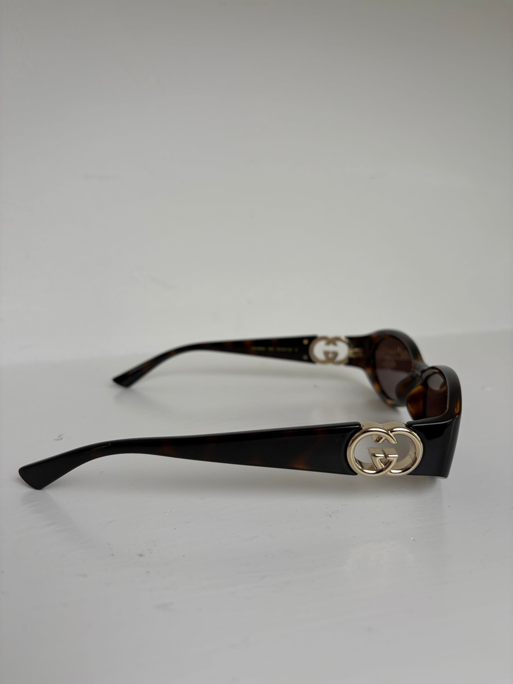 Gucci Tortoiseshell Oval Logo Arm Sunglasses