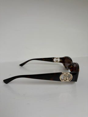 Gucci Tortoiseshell Oval Logo Arm Sunglasses