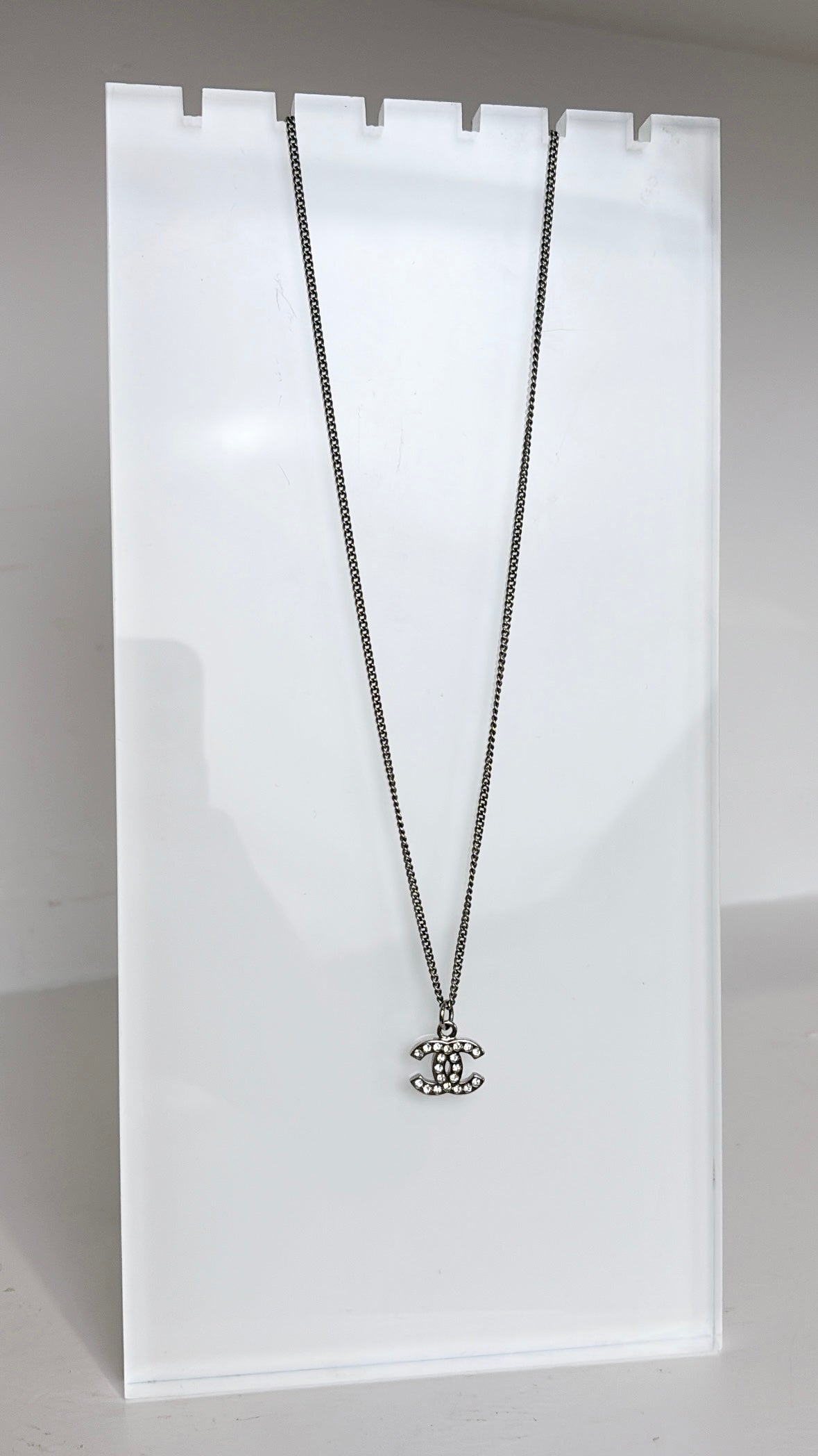 Chanel Silver and Crystal Logo Pendant Necklace