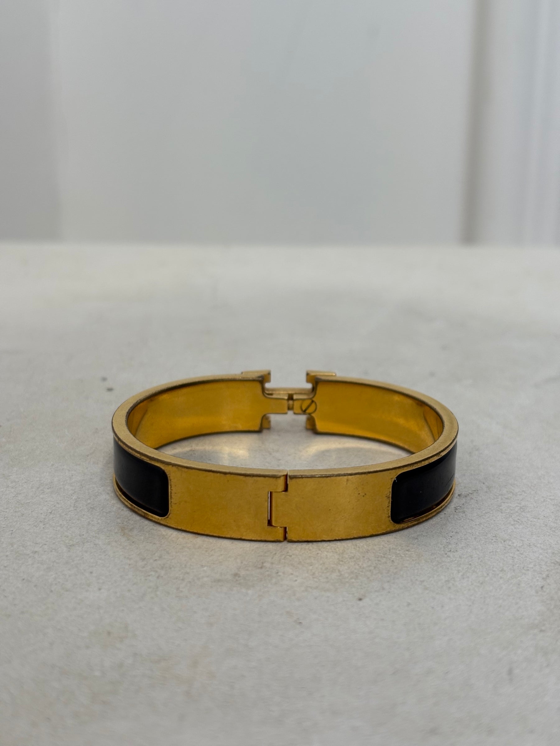 Hermès Black and Gold Clic H Bracelet