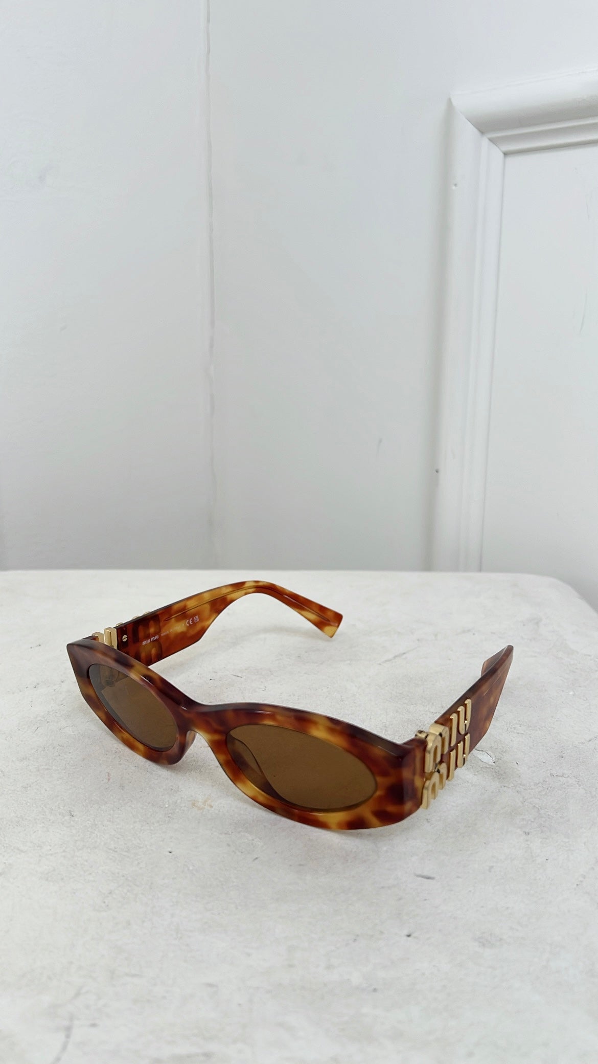 Miu Miu Tortoiseshell Oval Logo Arm Sunglasses