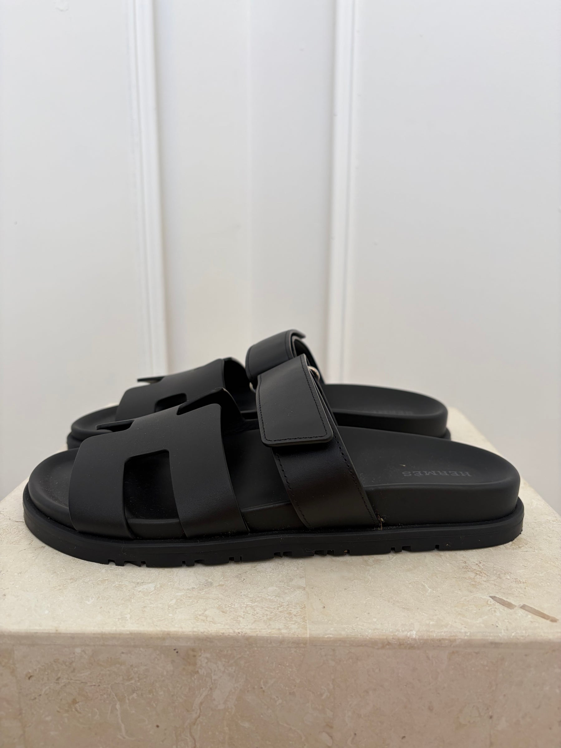Hermès Black Leather Chypre Sandals, 38.5