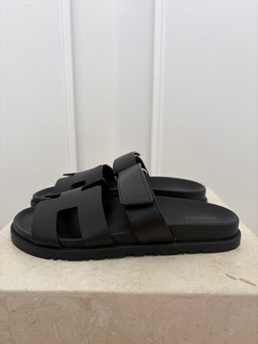 Hermès Black Leather Chypre Sandals, 38.5