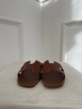 Hermès Gold Oran Sandals, 39