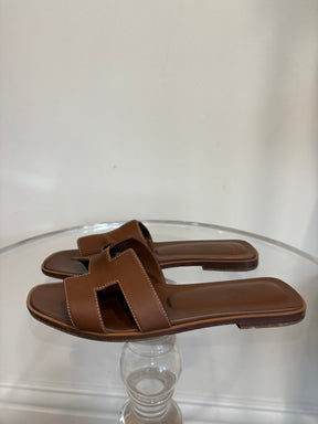 Hermès Gold Leather Oran Sandals, 39