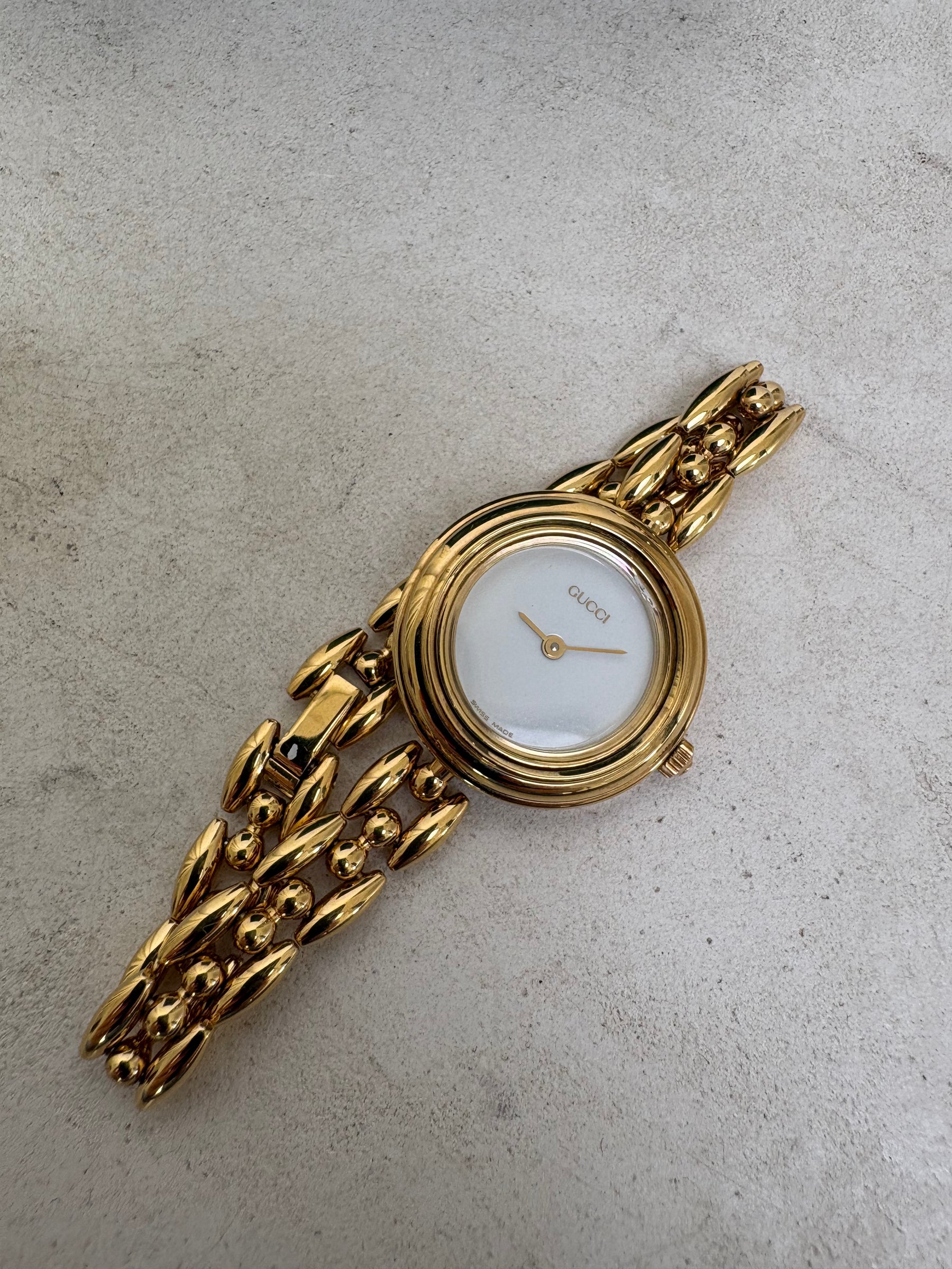 Gucci Gold Tone Interchangeable Bezel Watch