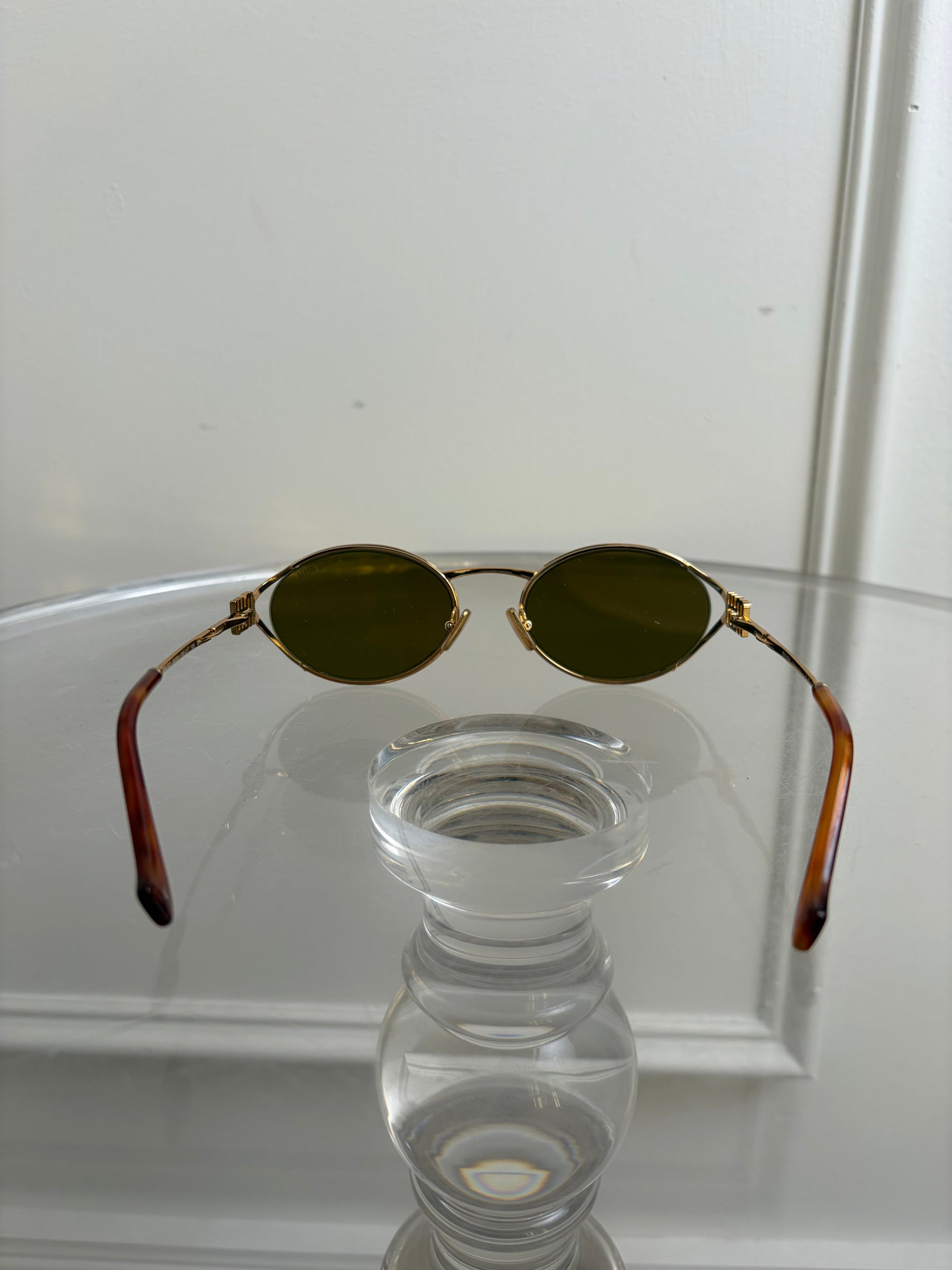 Miu Miu Gold Oval Logo Sunglasses