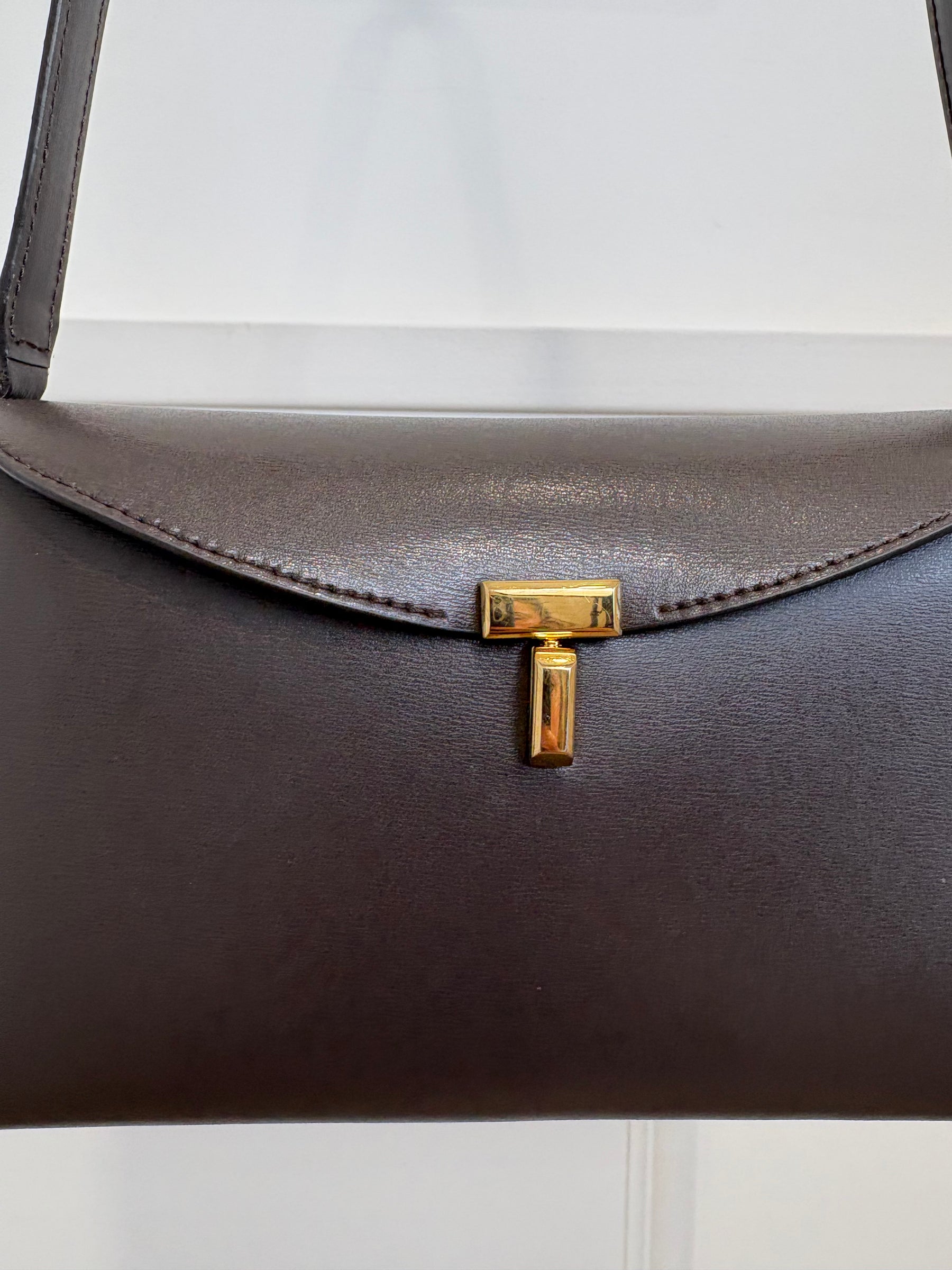 Totême Brown T-Lock Small leather clutch