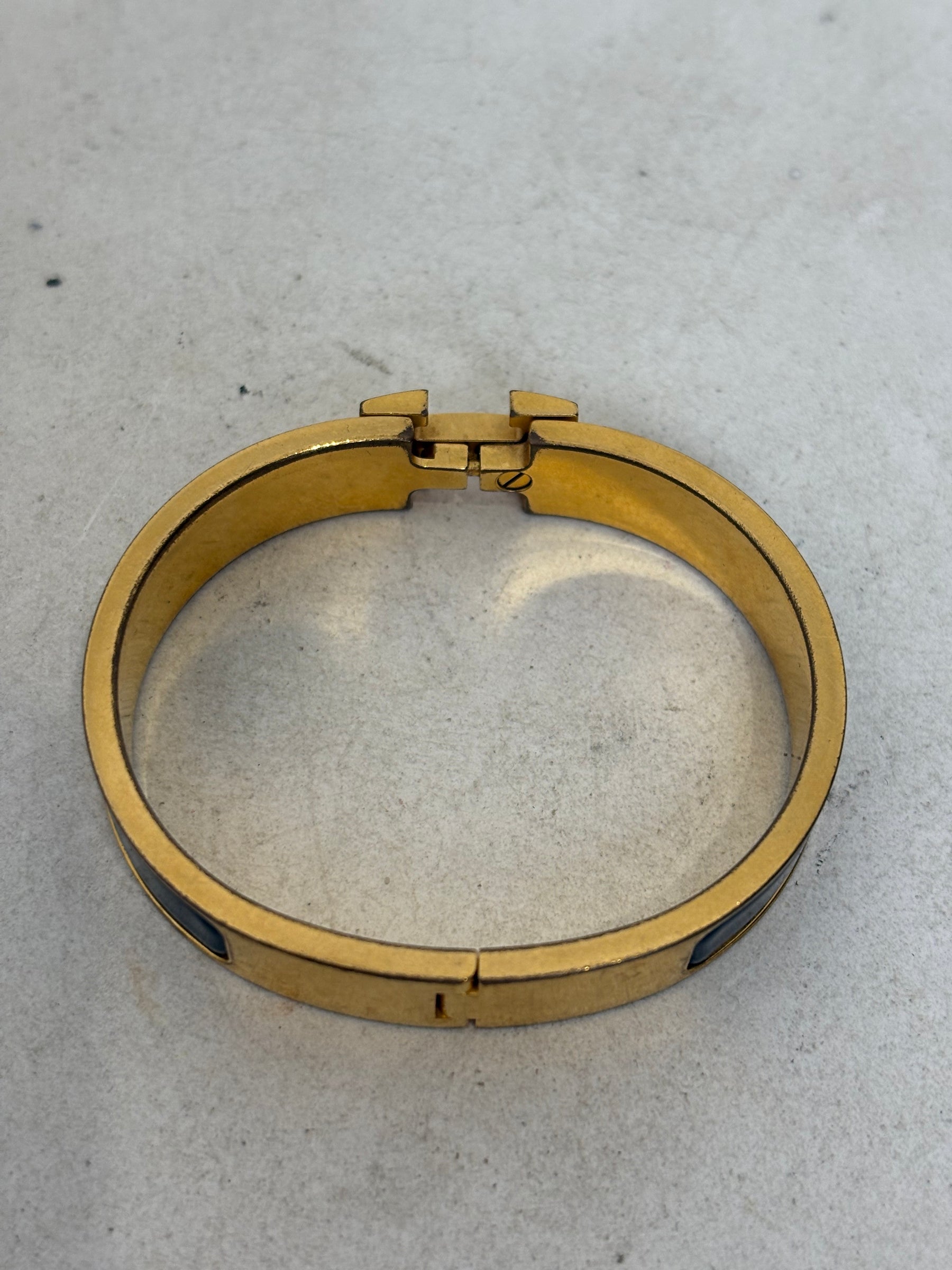 Hermès Black and Gold Clic H Bracelet