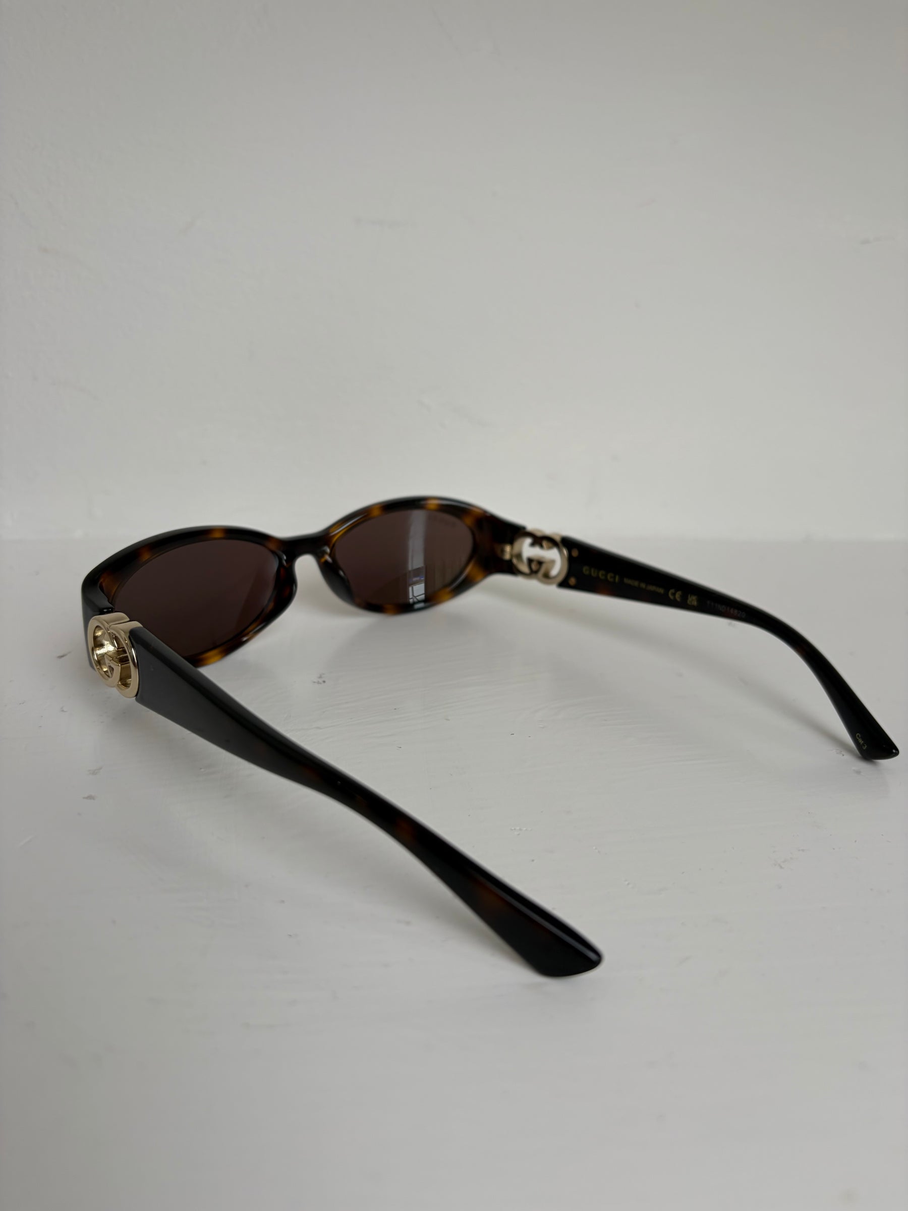 Gucci Tortoiseshell Oval Logo Arm Sunglasses