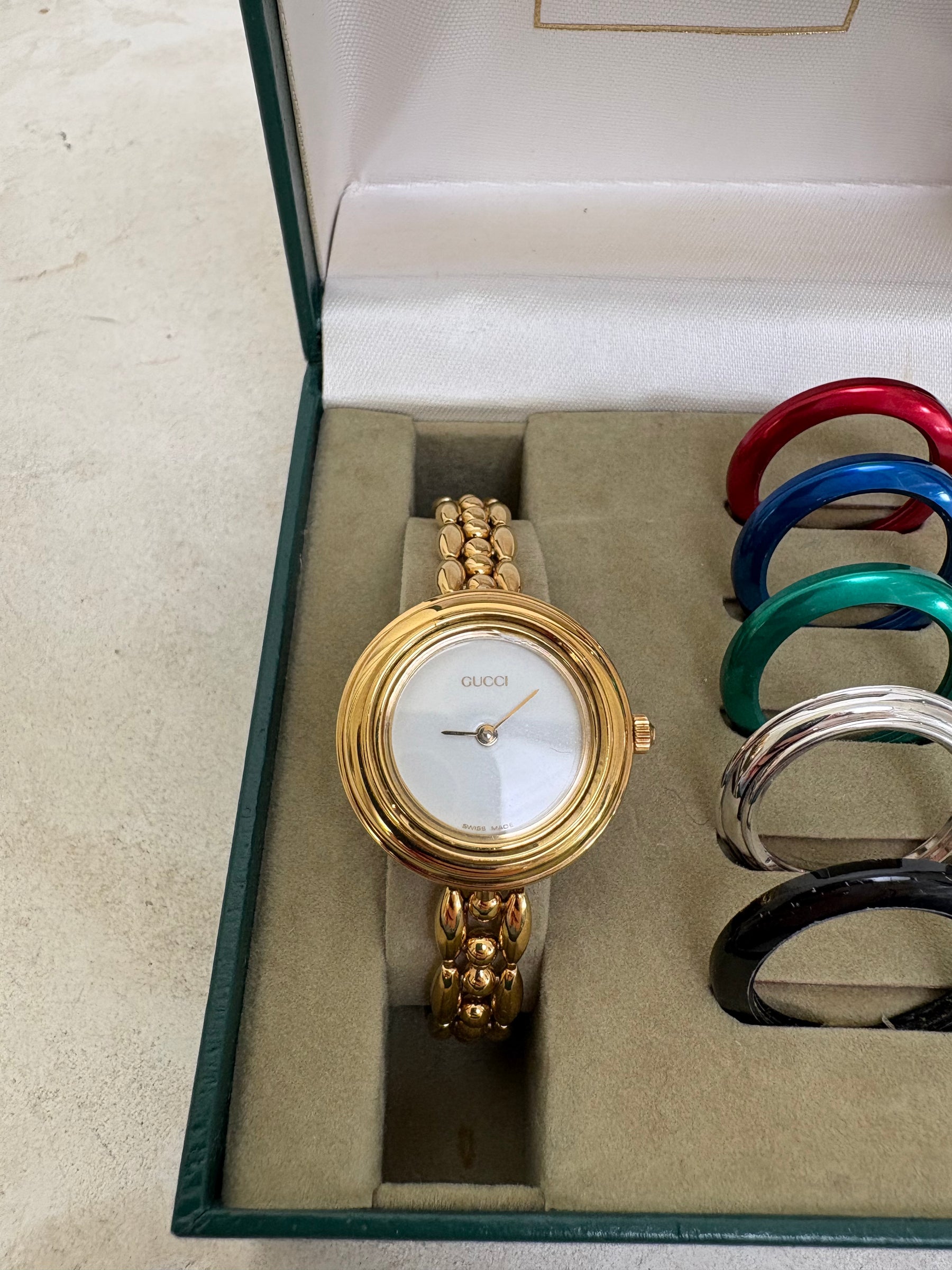 Gucci Gold Tone Interchangeable Bezel Watch