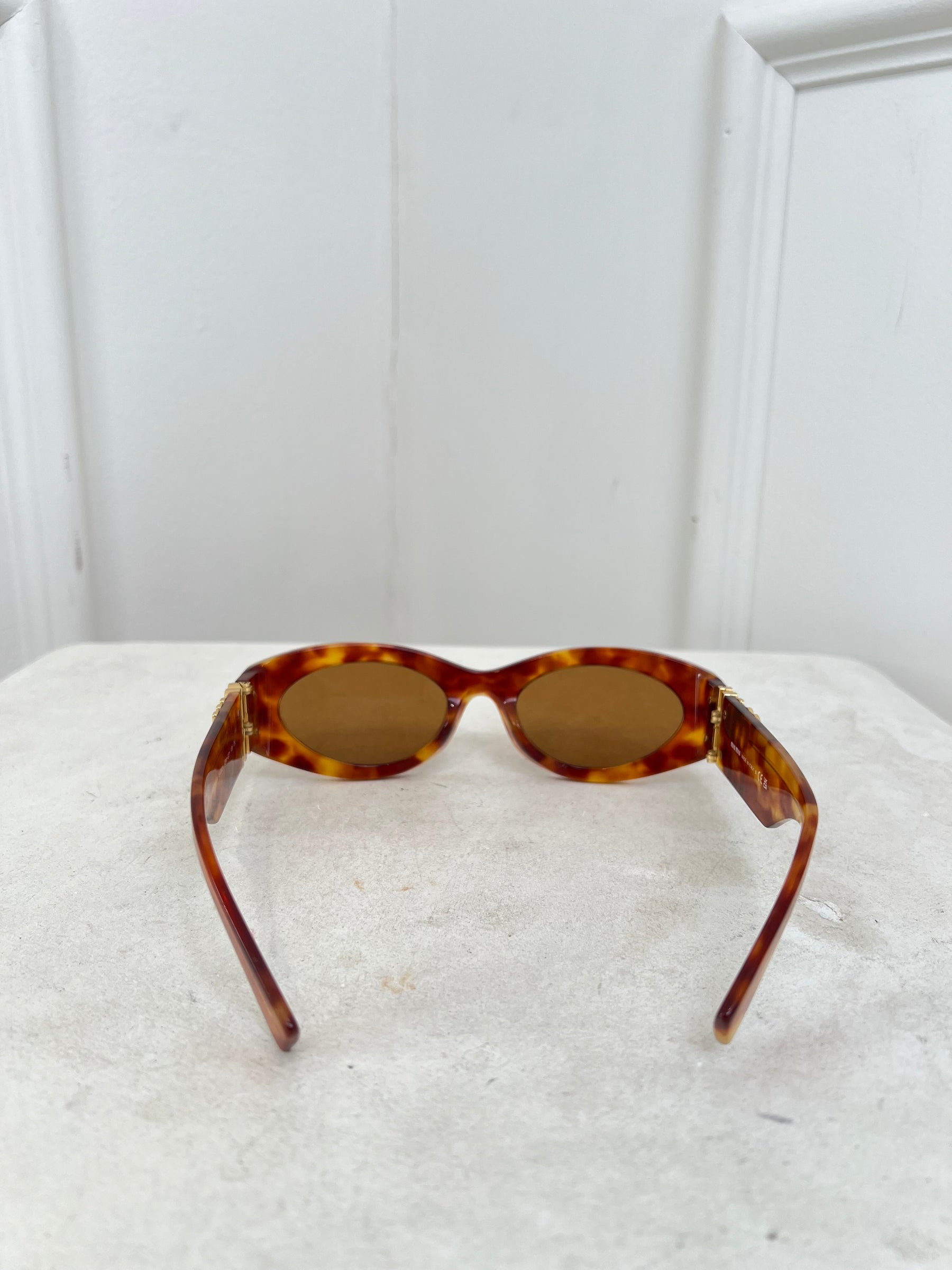 Miu Miu Tortoiseshell Oval Logo Arm Sunglasses