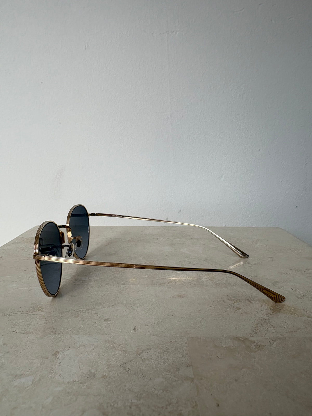 Oliver Peoples Gold Oval Sunglasses with Blue Lens
