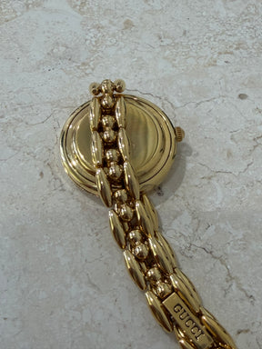 Gucci Gold Tone Interchangeable Bezel Watch