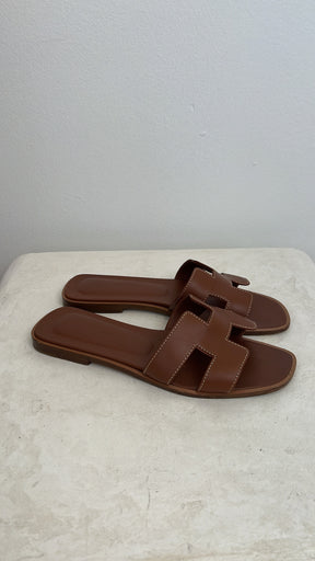 Hermès Gold Leather Oran Sandals, 36