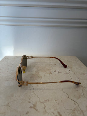 Miu Miu Logo Oval Sunglasses Gold