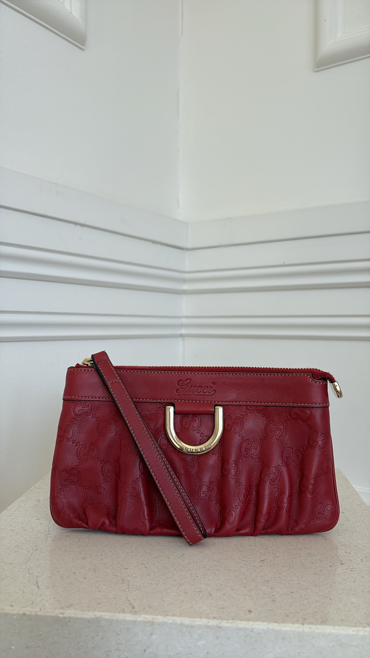 Gucci Red Monogram Embossed leather Wristlet Pouch