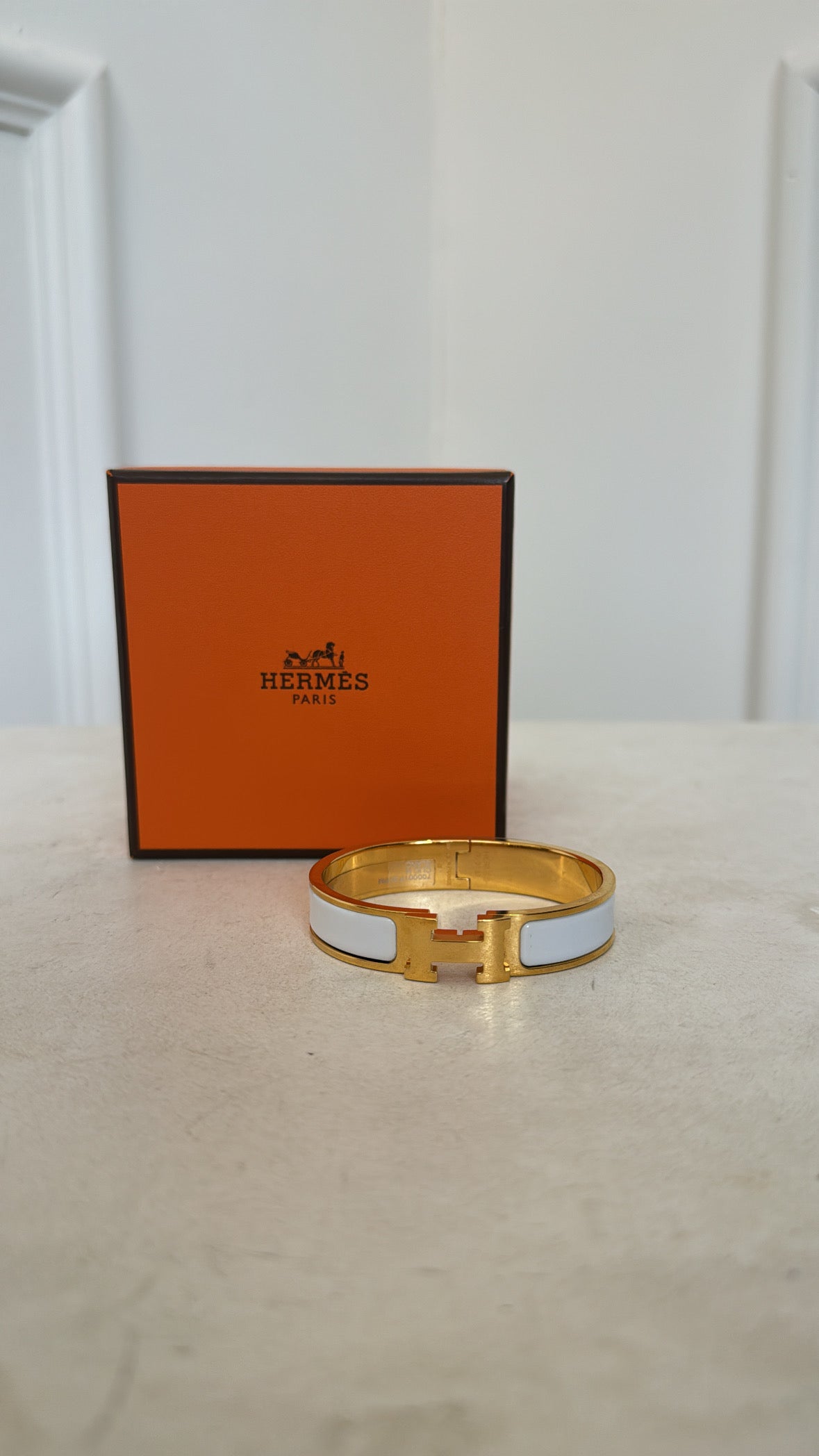 Hermès Gold Tone and White Enamel Clic H bangle