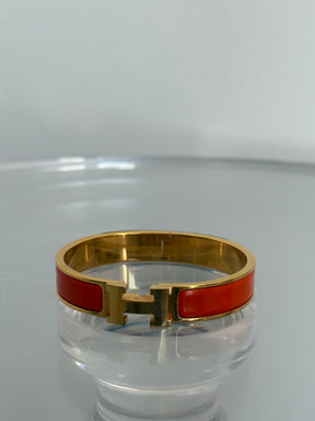 Hermès Orange and Gold Clic H Bracelet