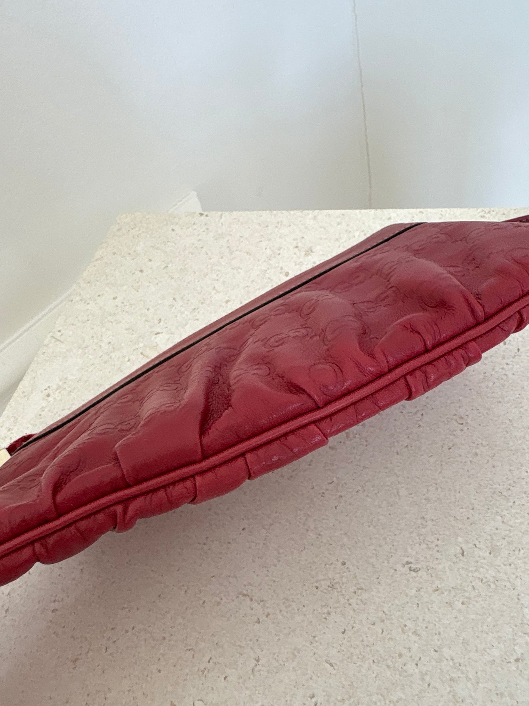 Gucci Red Monogram Embossed leather Wristlet Pouch