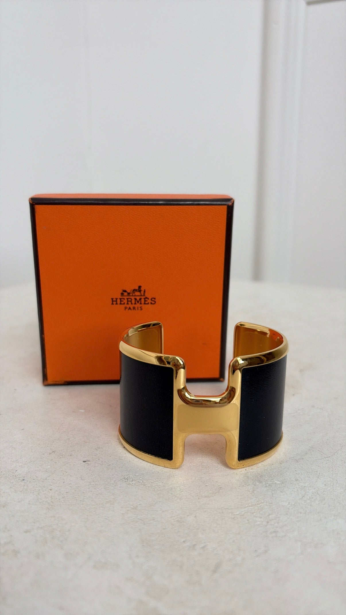 Hermès Black and Gold Leather Olympe cuff bracelet