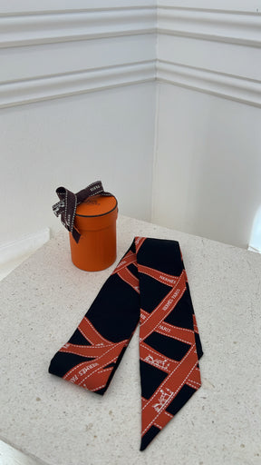 Hermès Black and Orange Ribbon Print Silk Twilly