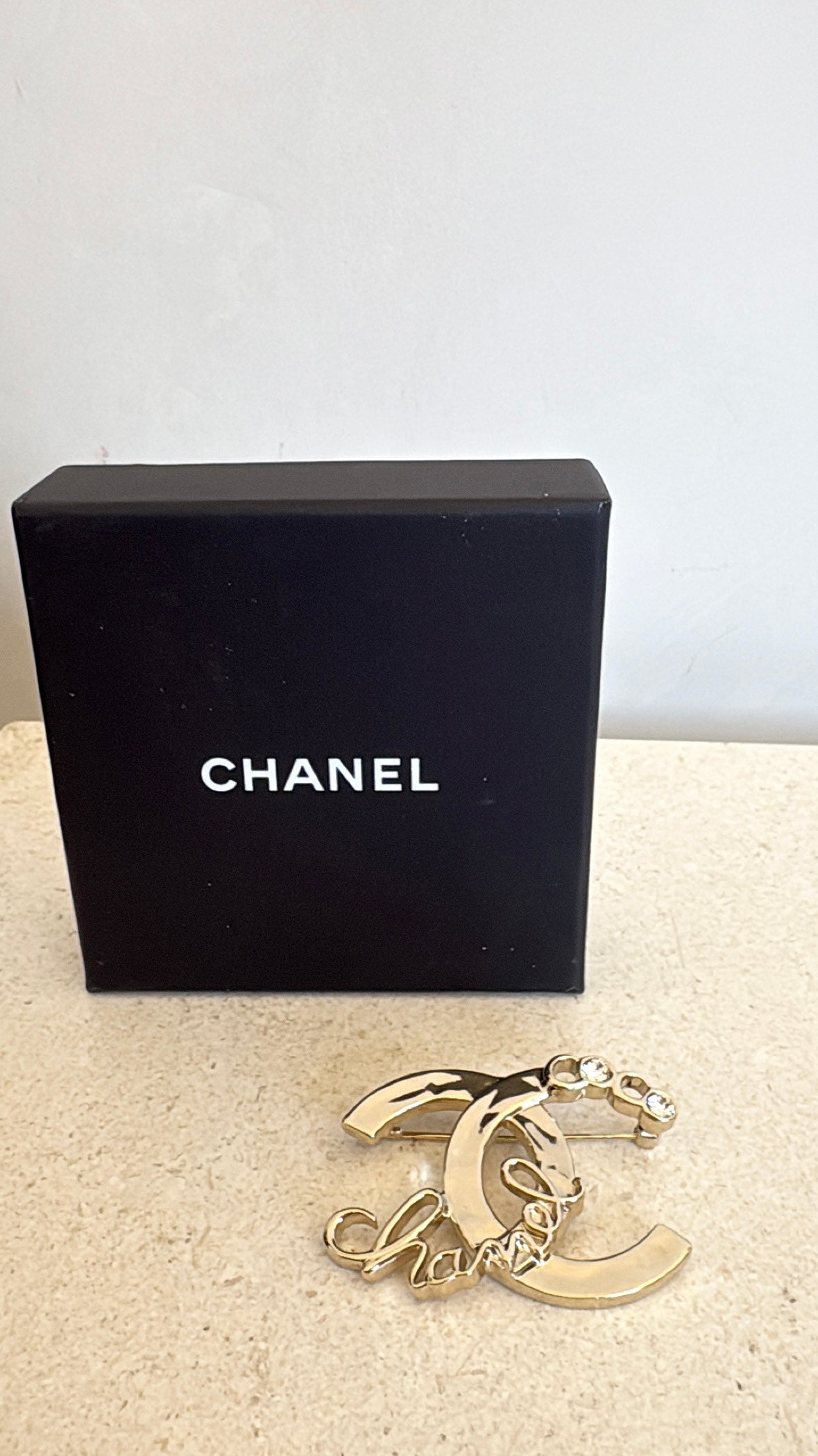 Chanel Gold Tone Logo Crystal brooch