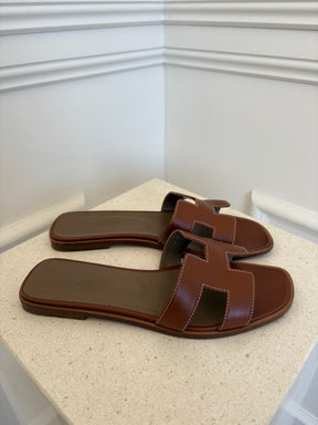 Hermès Gold Leather Oran Sandals, 38.5