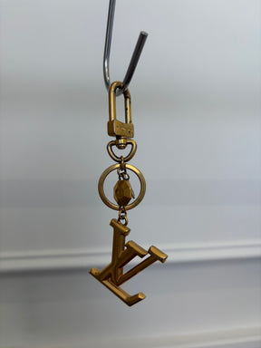 Louis Vuitton Gold Tone Logo Charm,